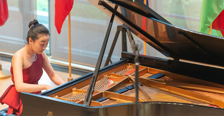 student playing the piano