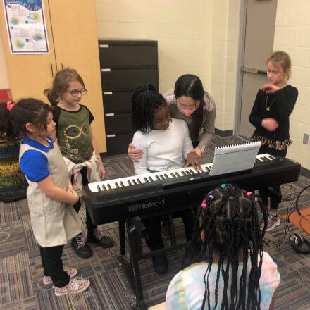 students playing the piano